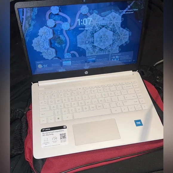 HP Silver Laptop with Black and Red Accessories